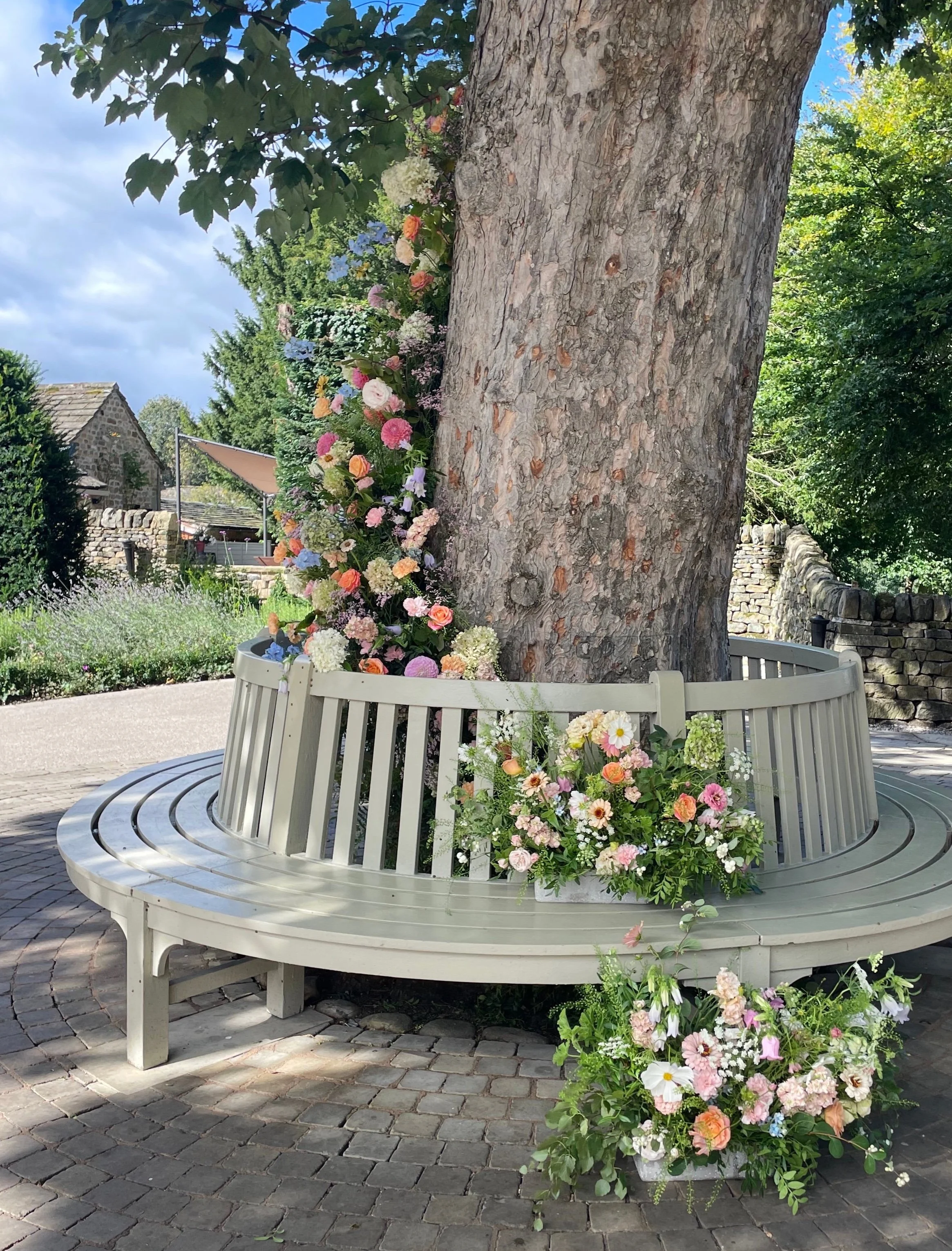 tree wrapped with flowers at the Tithe Barn, Bolton Abbey, Yorkshire