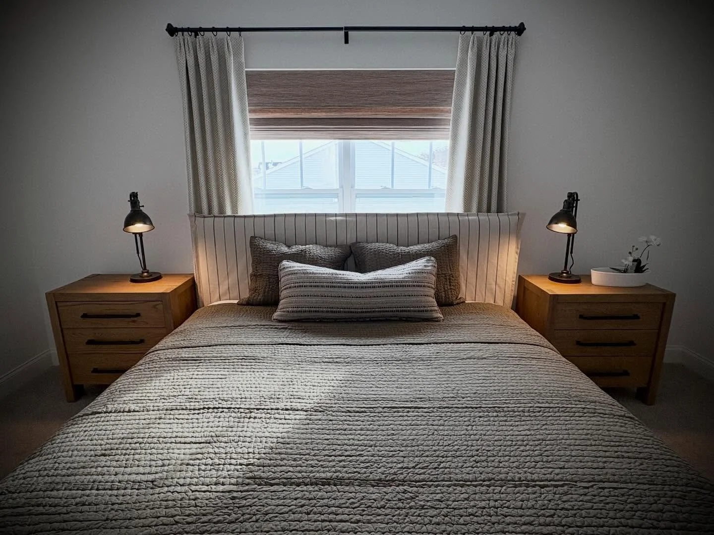 Sometimes it is ok to put the bed in front of the window.  This was a small room , great for guests but we needed a king size - frame it out with drapery behind - perfect #bedroomdesign #layoutdesign #mobiledesignvan