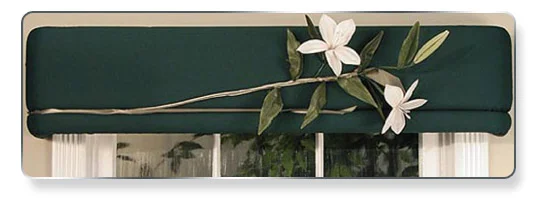 Just pin on one elegant lily on dark green fabrics — dramatic!