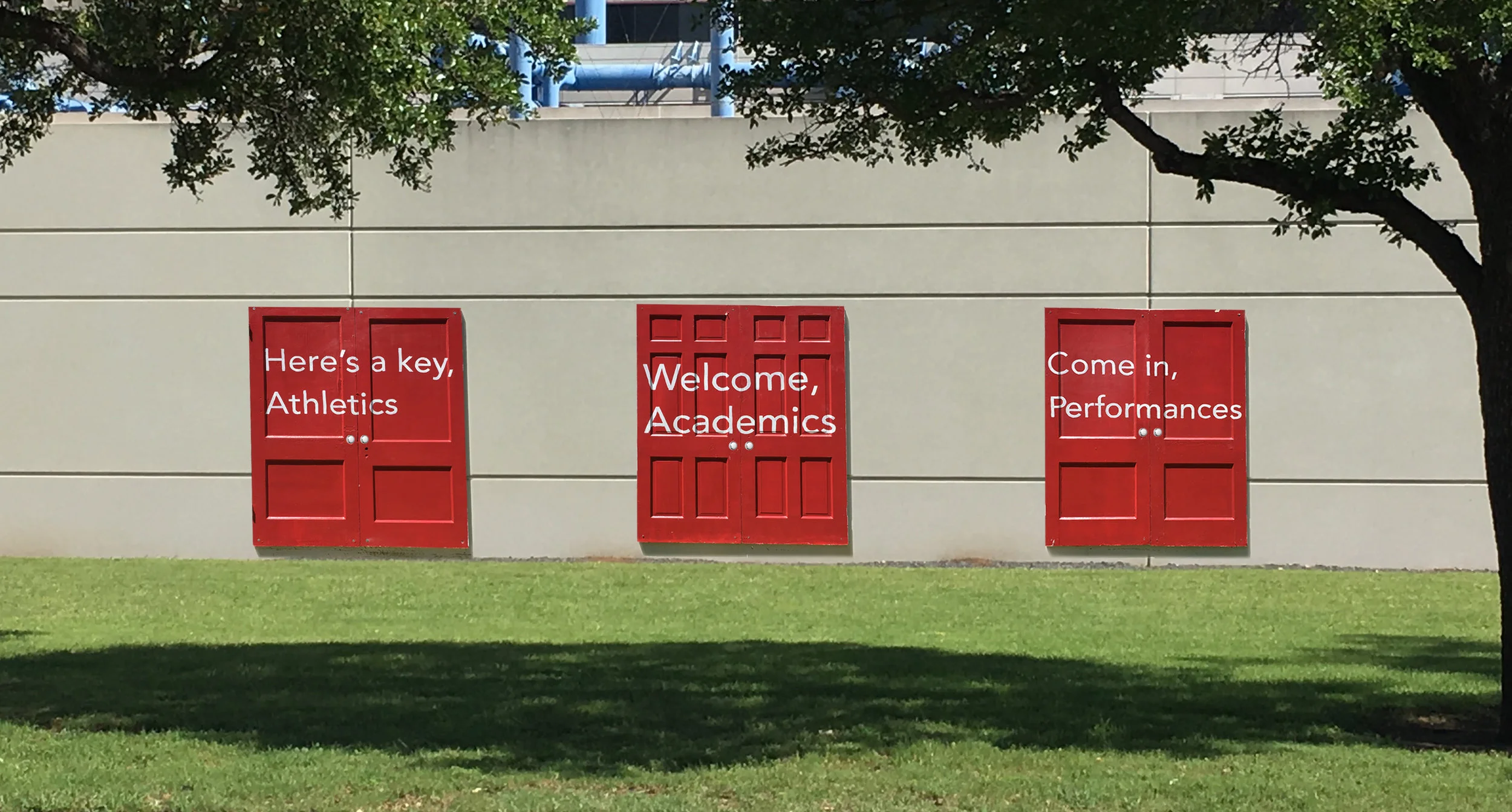 Red doors installed around campus to “open the minds” of parents and students to the unlimited possibilities that awaited.