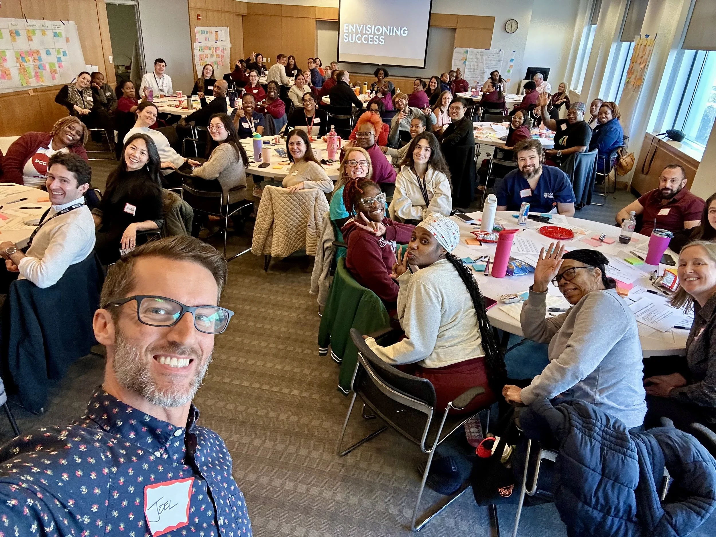 Joel Worthington facilitating a large healthcare retreat with cross-disciplinary leaders