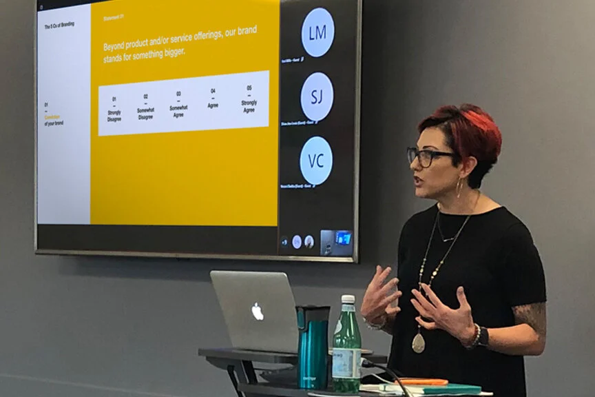 Julie leading attendees through a self-evaluation exercise and high-level assessment of their brands.