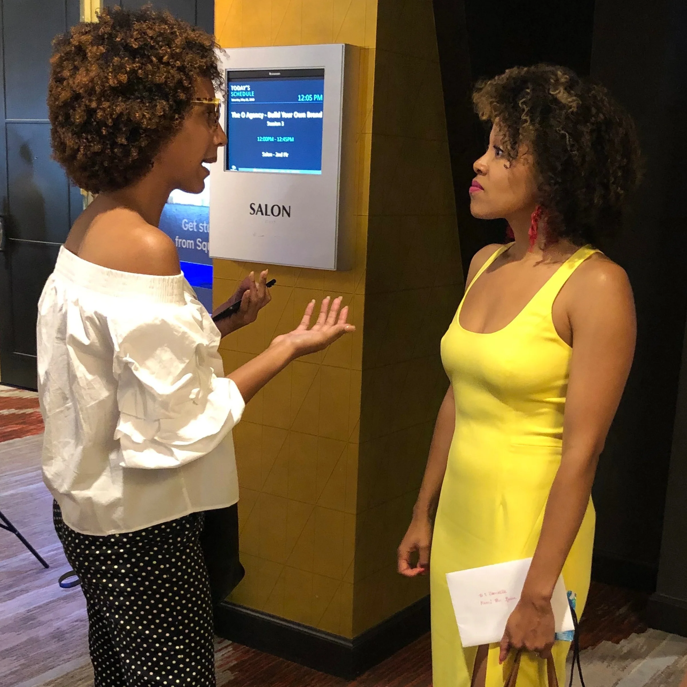  DANIELLE LESLIE ENGAGING WITH EVENT ATTENDEES  