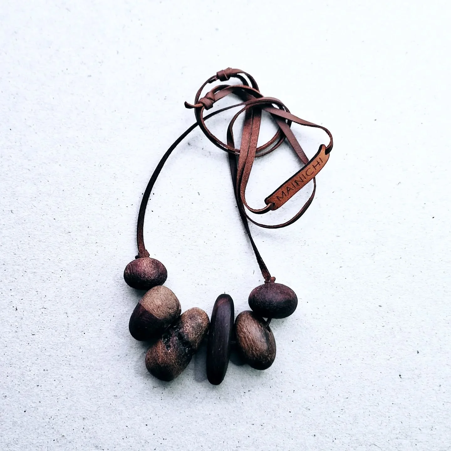 Beautiful native Australian timber beads strung on leather by MAINICHI.  All these timbers are recycled or salvaged.  Perfect unisex pieces, available online at www.mainichi.com.au/shop
#handmadeinaustralia #handmadejewellery #recycledwood #Sustaina