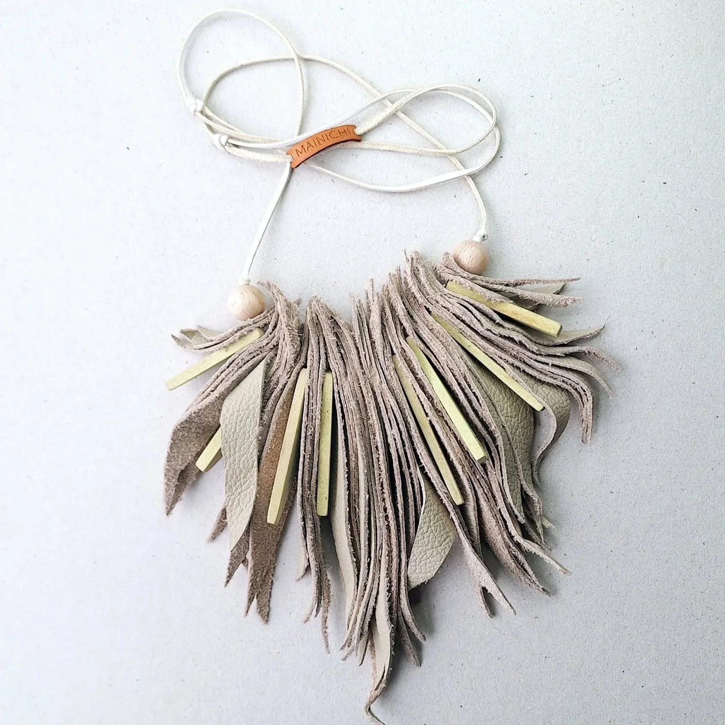 The softest recycled upholstery leather and repurposed wooden beads combine to create this statement Feather necklace.
Handmade by MAINICHI
Buy exclusively online at www.mainichi.com.au or come see more of this sustainable style at the @ballaratnig