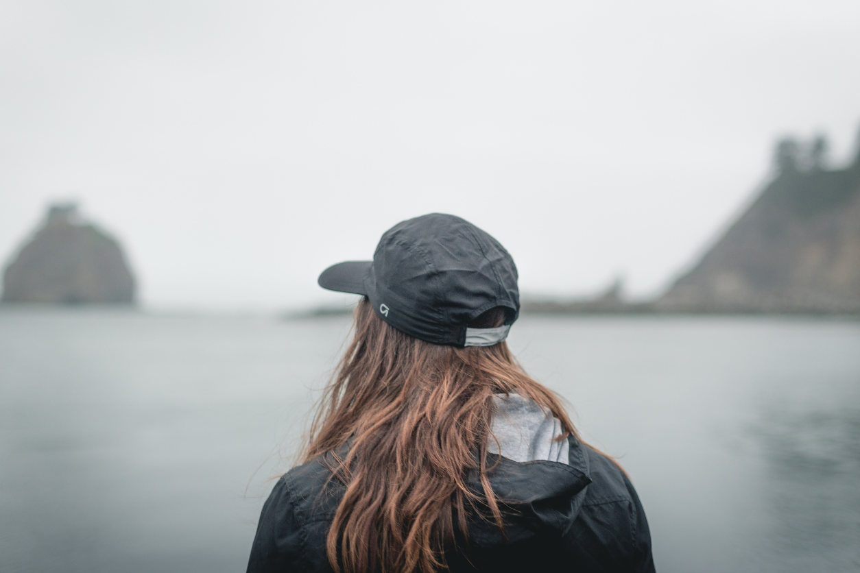 woman looking over the water