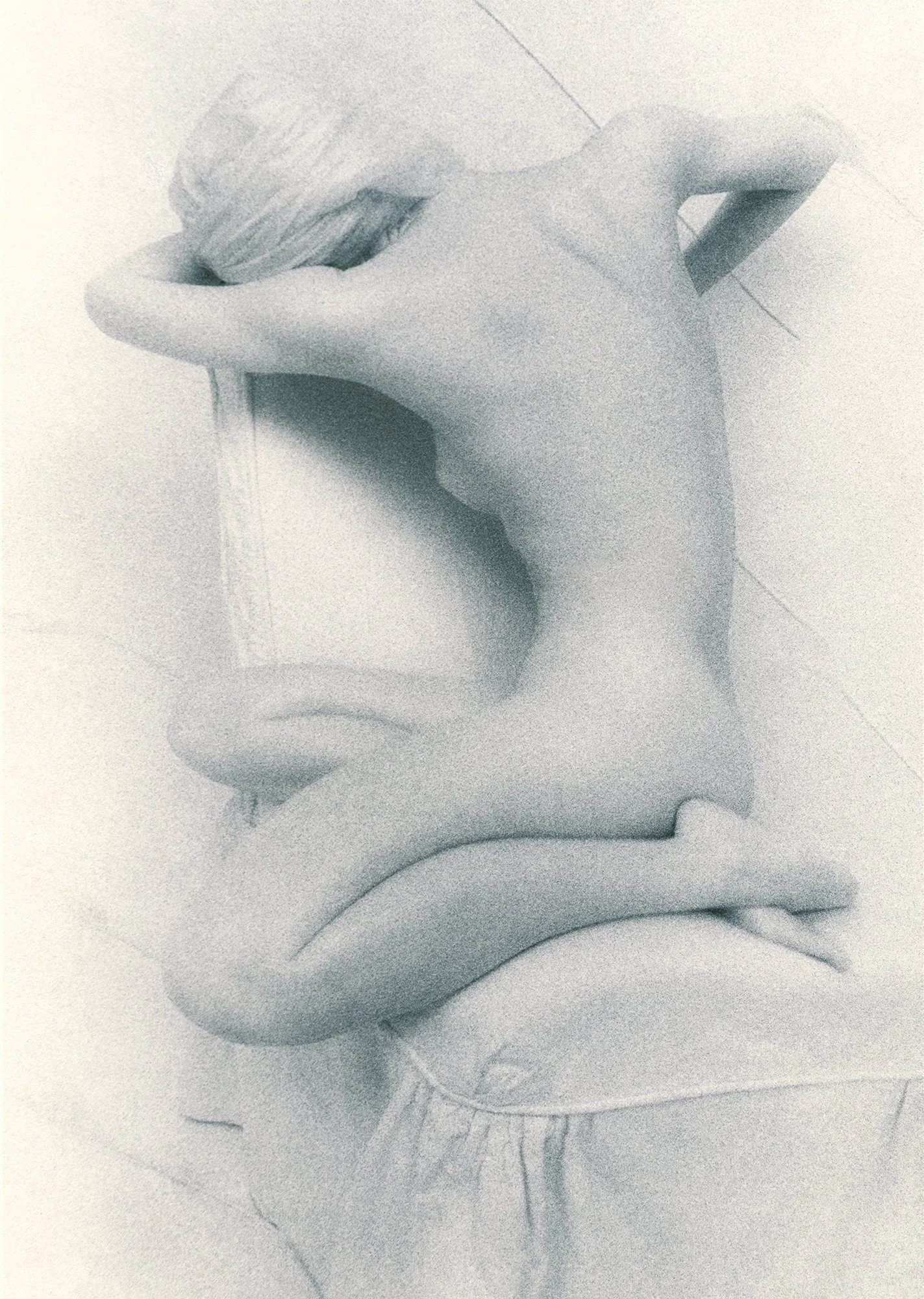 Seated Woman, 1997, gold-toned silver gelatin print, w:8’’ h:10’’