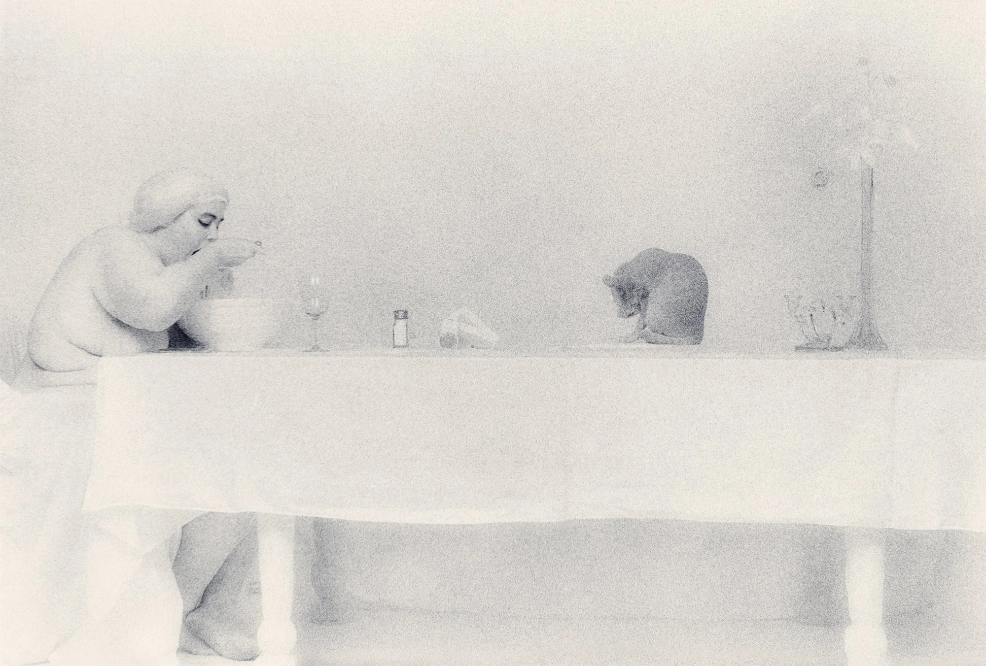 Spaghetti Eater With Cat, 1998, gold-toned silver gelatin print, w:16’’ h:20’’ and w:20” h:24”