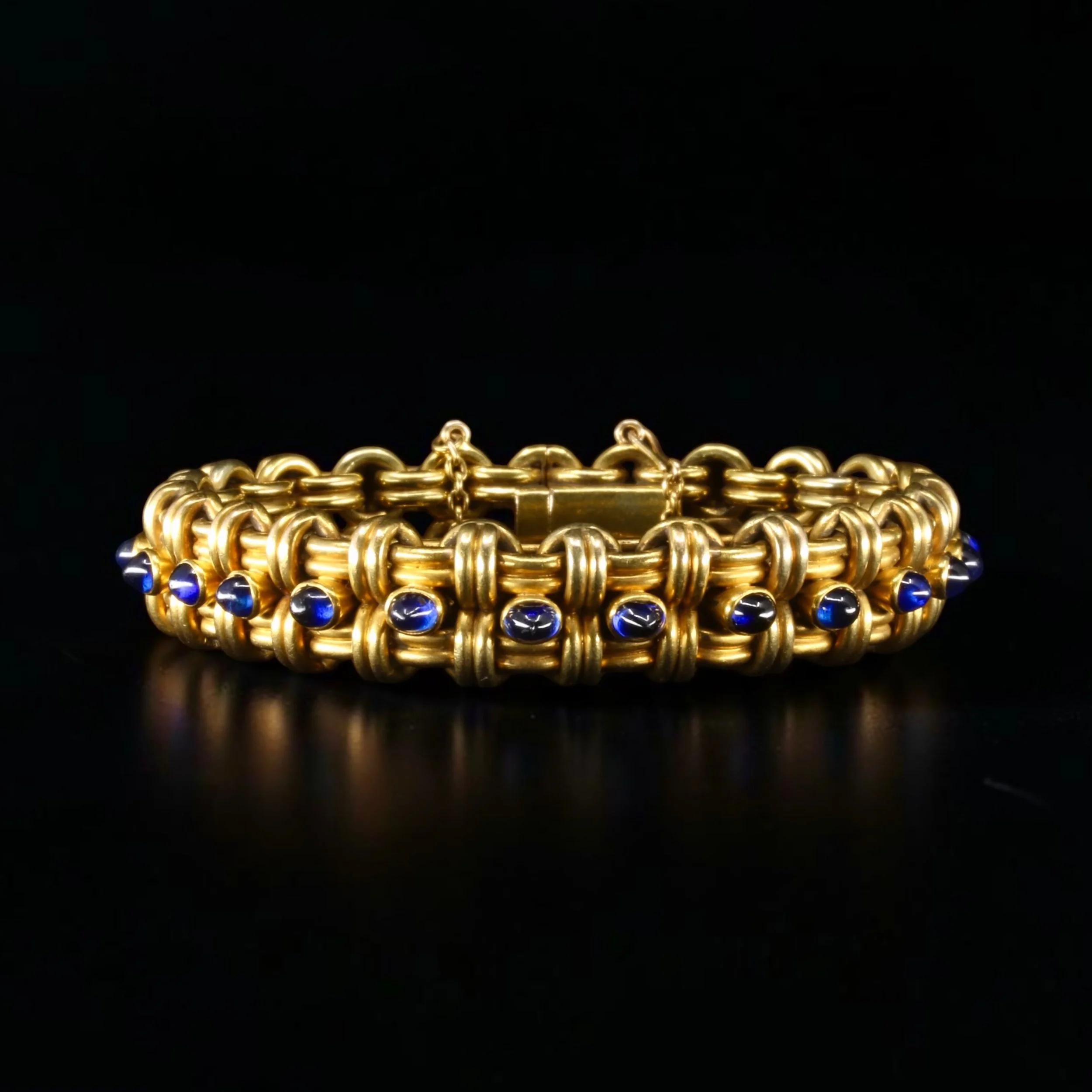 Friedrich Kochli - Here is a rare Russian bracelet and collectable piece from the late 19th century signed by Friedrich Kochli.

The bracelet is in 14-karat gold and set with 24 cabochon-cut natural sapphires and bears the maker's marks "FK&quot