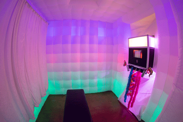 A view inside Party-O-Matic's Glow Booth. The light show can be slowed down, maintain a solid color, or do a variety of over 300 different patterns.