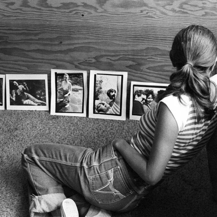 woman looking at photos.png