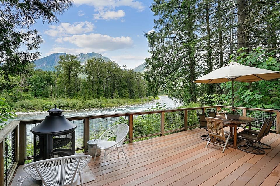 Relax by the riverside at this  cozy cabin  nestled at the bottom of the Cascade Mountains! This getaway features a riverside firepit, fully stocked kitchen, countless neighboring activities for the whole family.    Typical starting price: $153    L