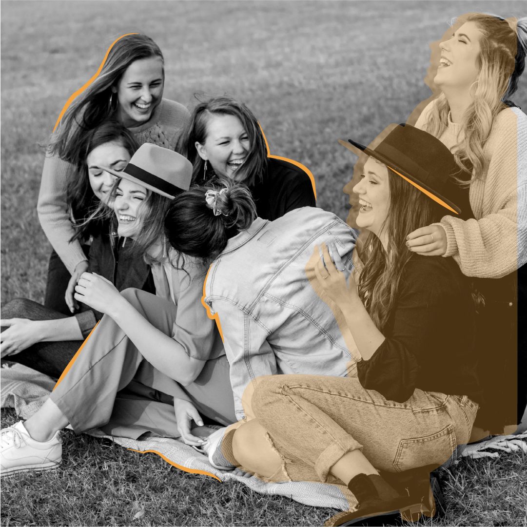 Female friends laughing in a park