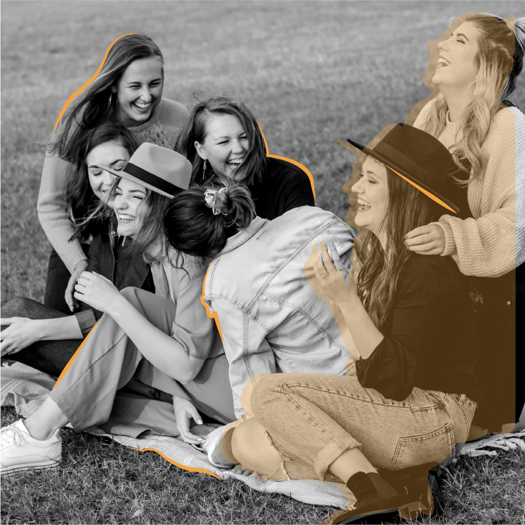 Female friends laughing in a park