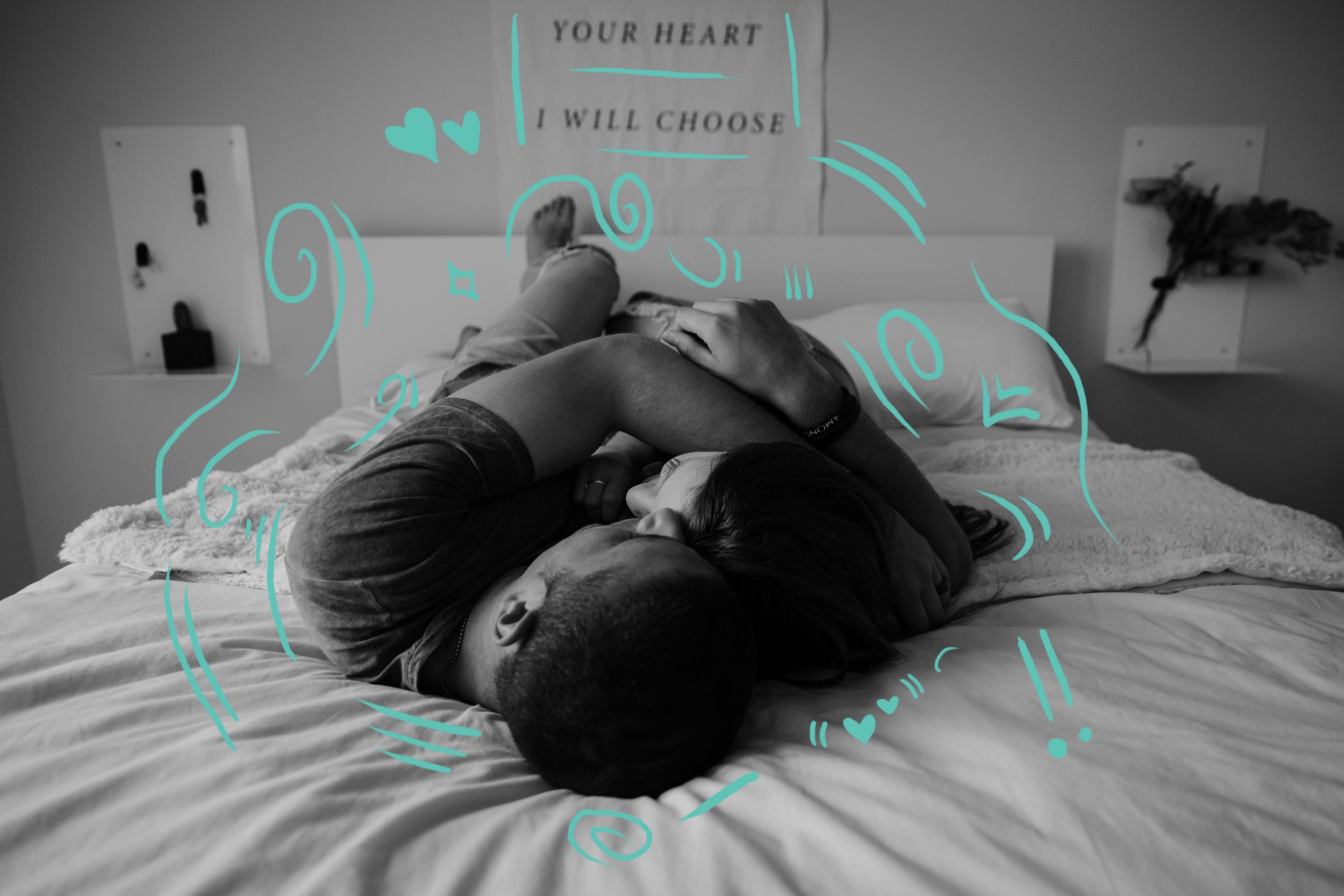 heterosexual couple cuddling in a bedroom