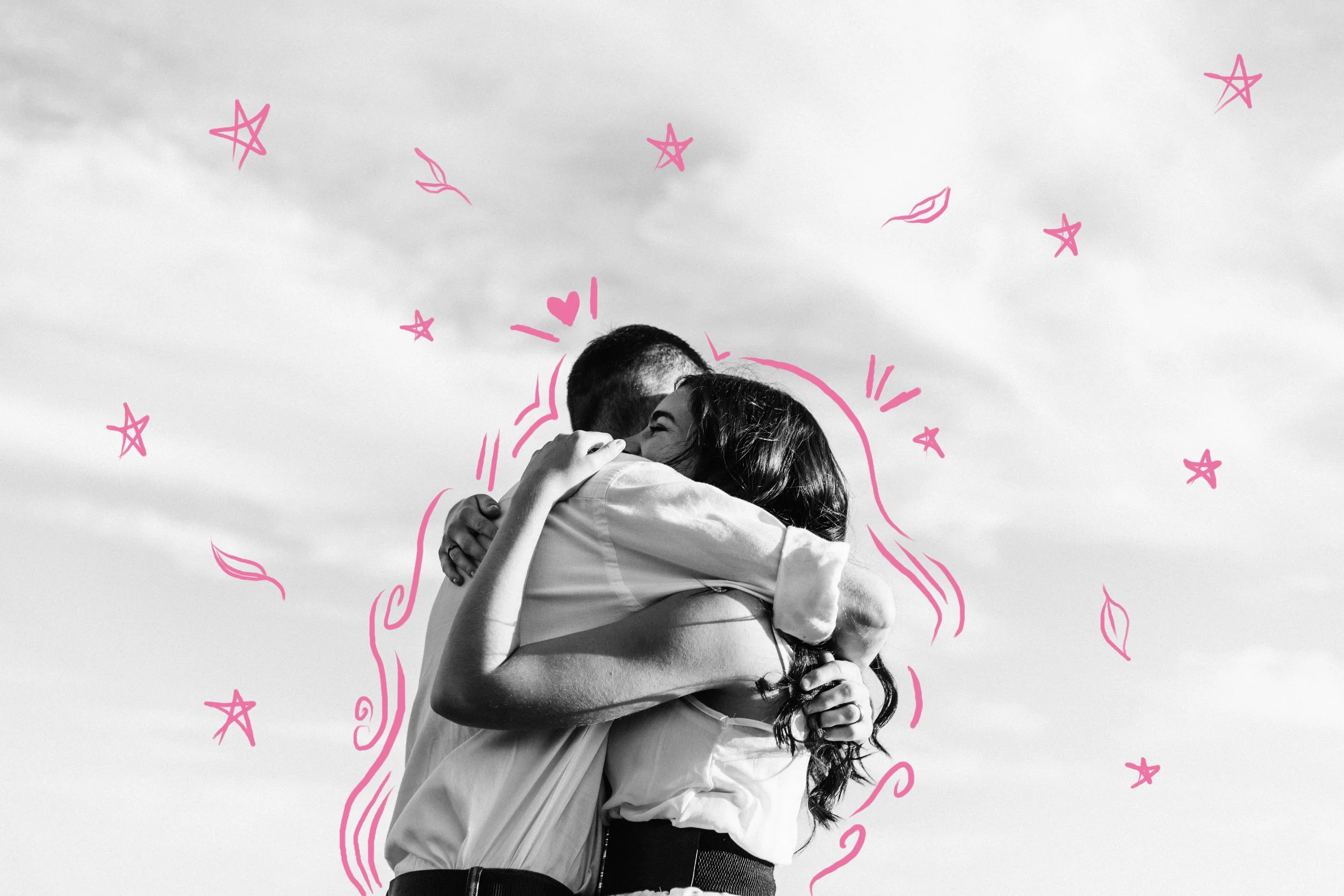 Heterosexual couple hugging in front of the sky