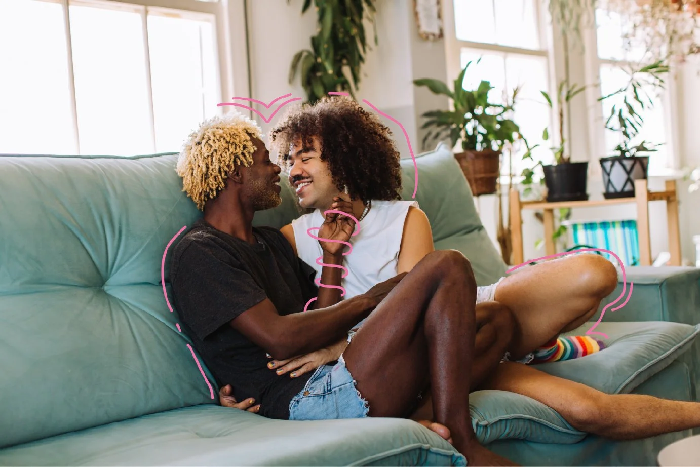 Same sex male relationship cuddling on couch