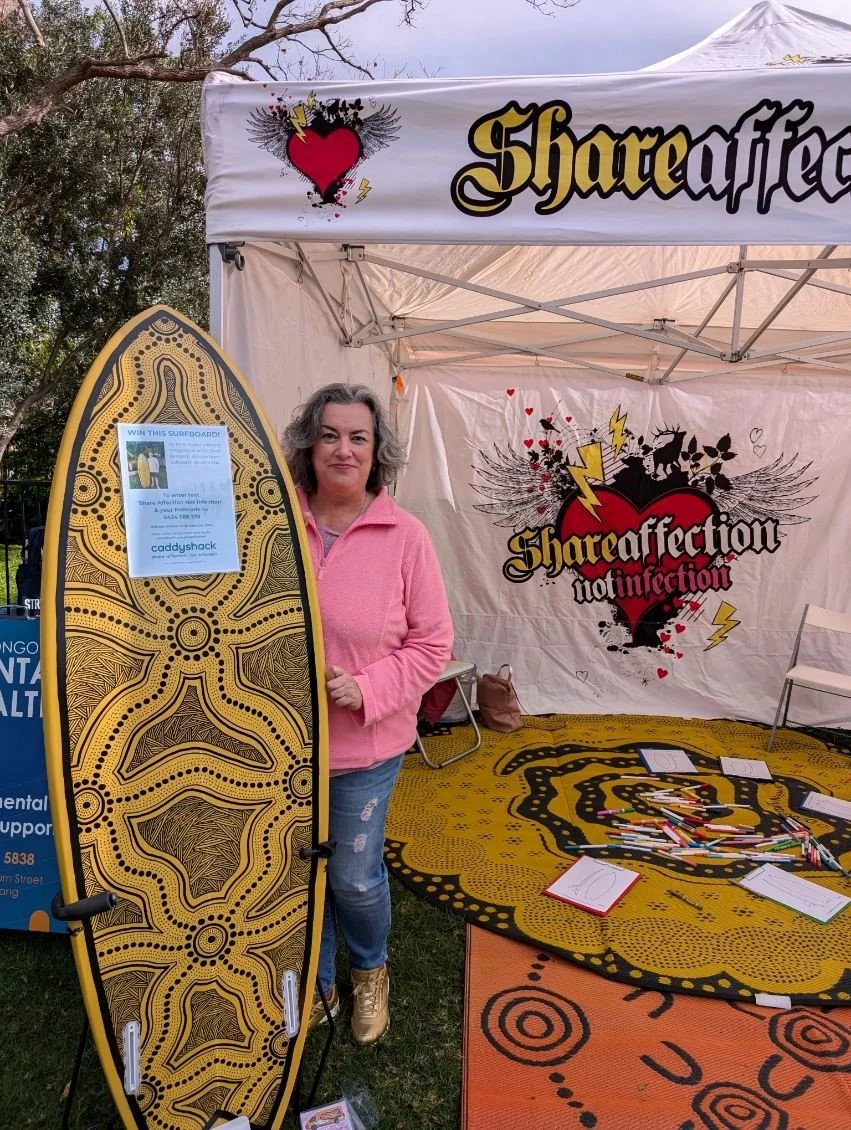 Jen with board Bellambi 2024.jpg