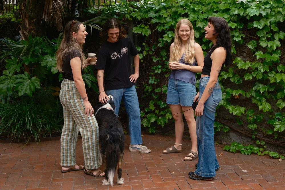 friends talking and laughing with dog.jpg