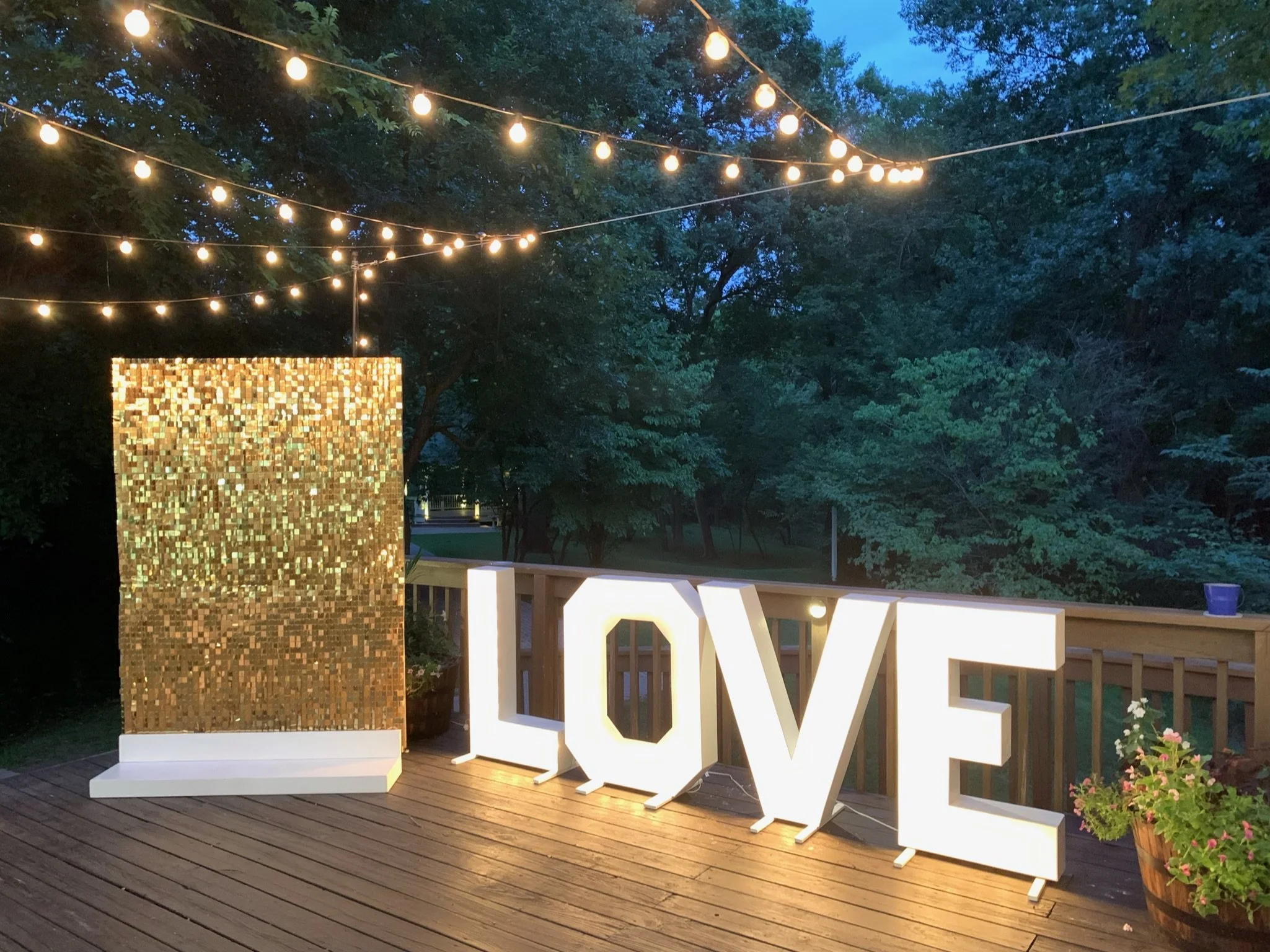 gold sequin wall with LOVE at the glass chapel.JPG