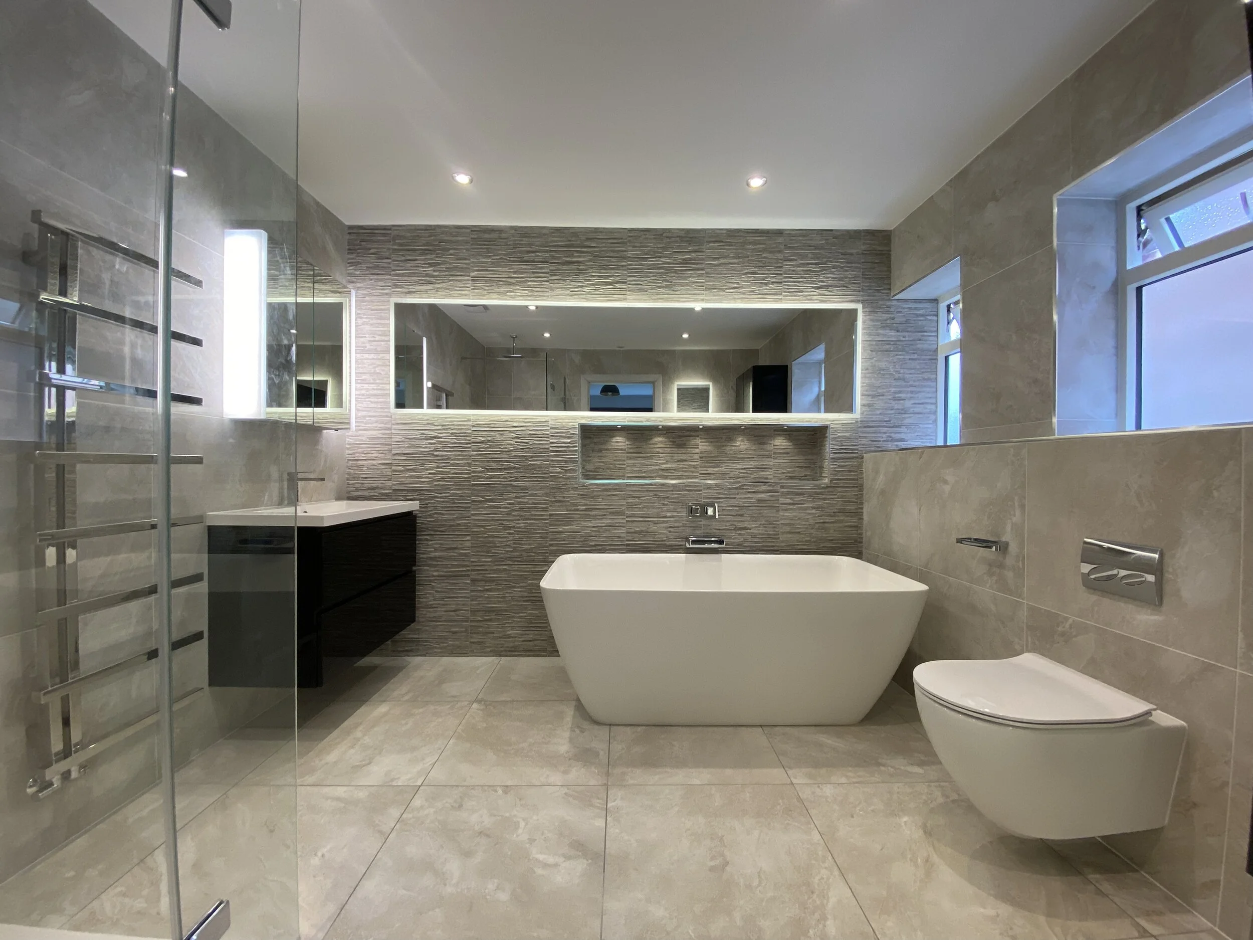 Elegant Bathroom Design with Textured Feature Walls & Freestanding Bath