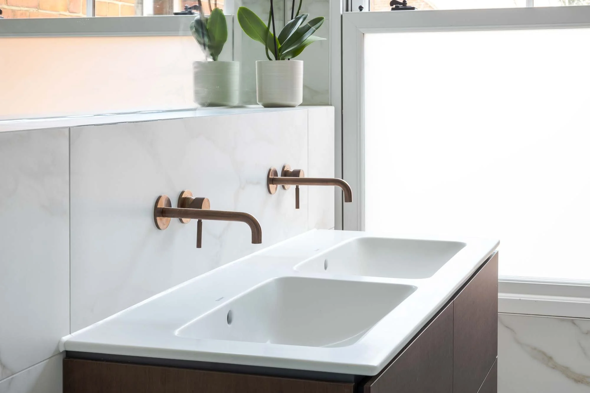 A Contemporary Bathroom with Warm, Elegant Finishes