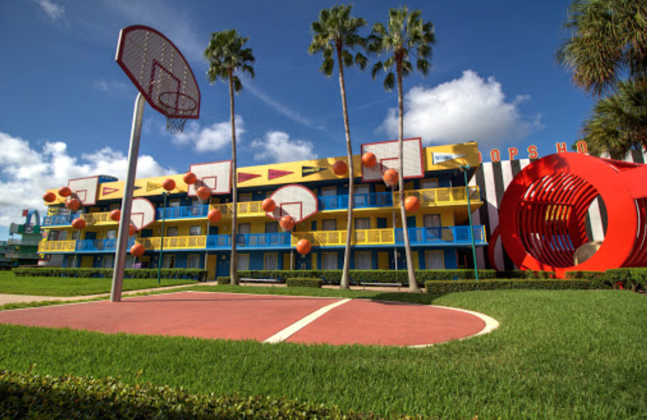 Disneys All Star Sports Resort Value Theming football tennis surfboard pool busy crowded football field turf cheerleading competitions quick service disney travel agent busy mom working mom family vacation