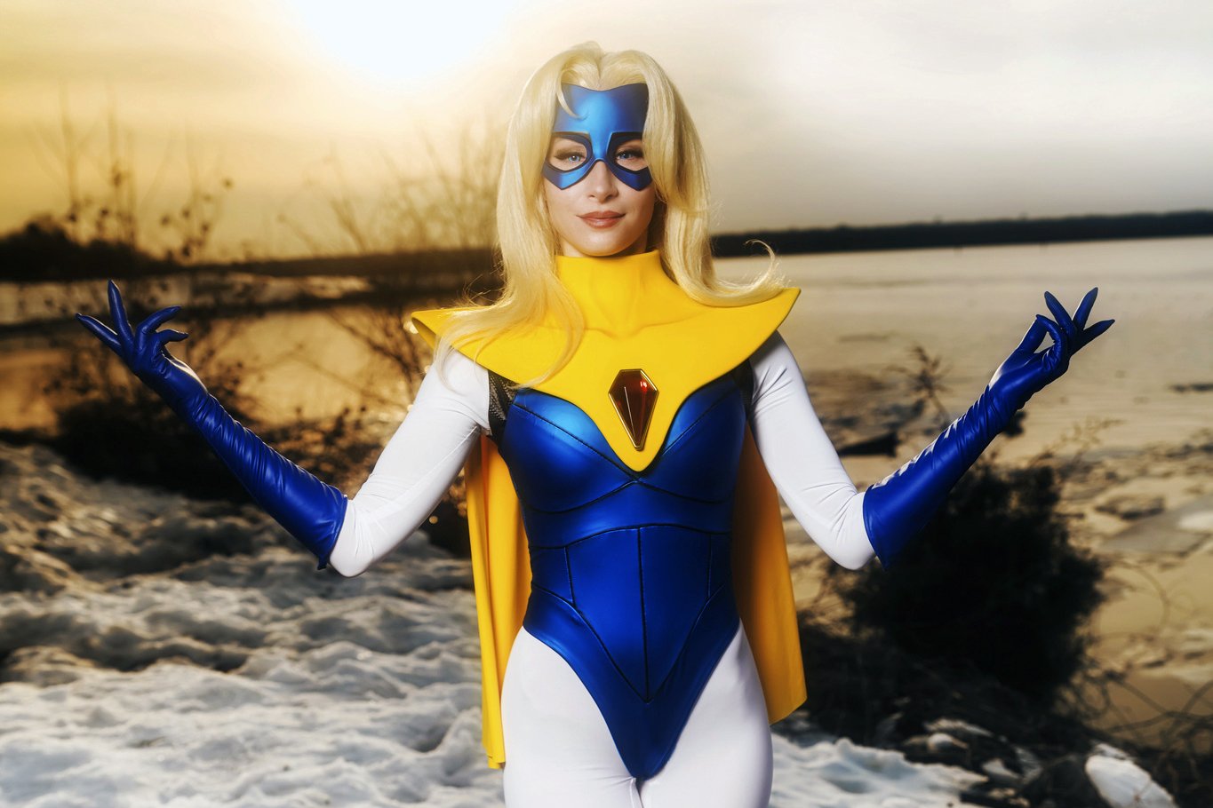 Bindi Smalls in a blue-and-yellow superhero cosplay, showcasing character-driven creative work.