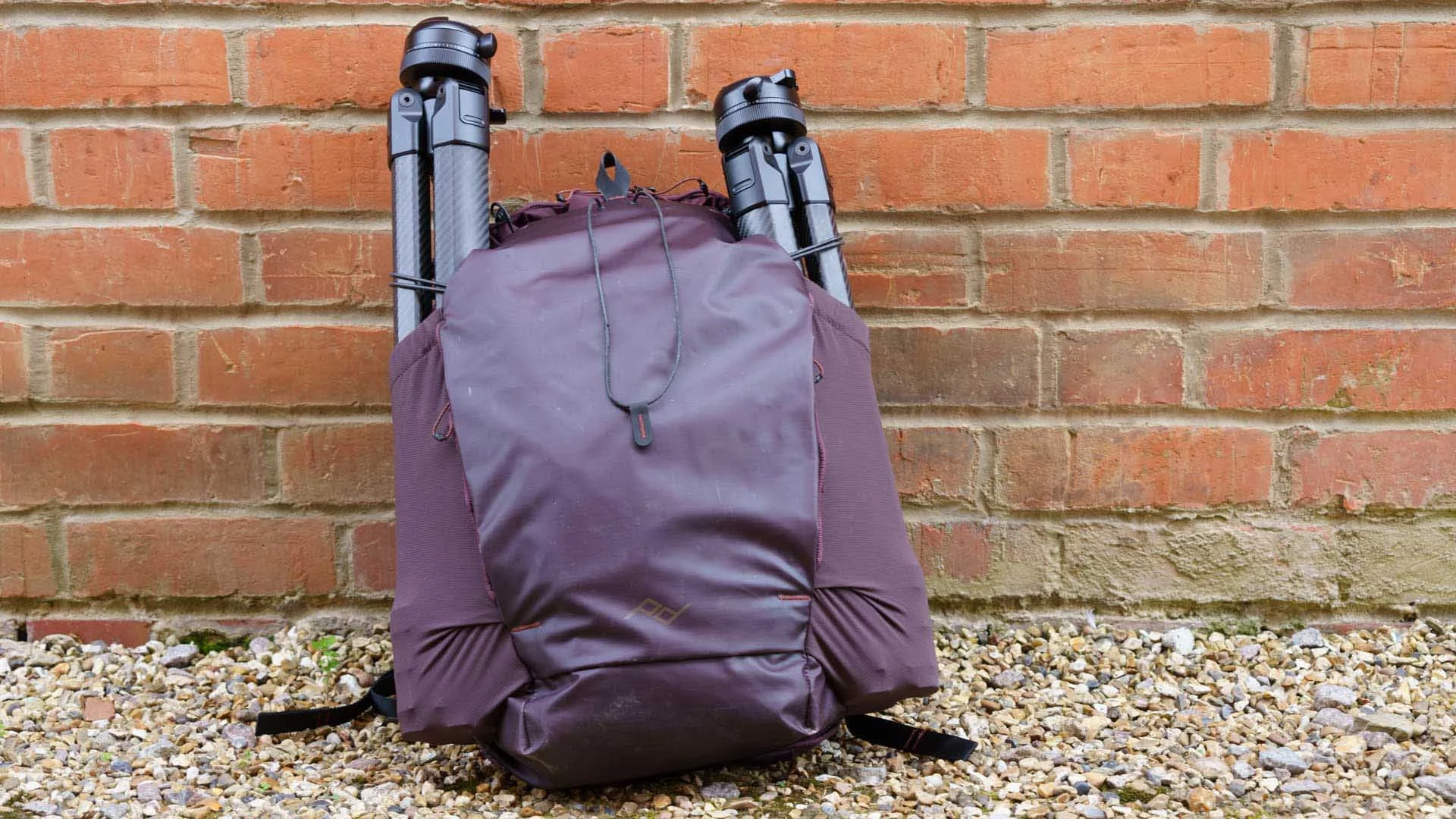  The Peak Design Pro Tripod Tall (left) and Pro Tripod (right) in the side pockets of the Peak Design Outdoor Backpack 25L. 