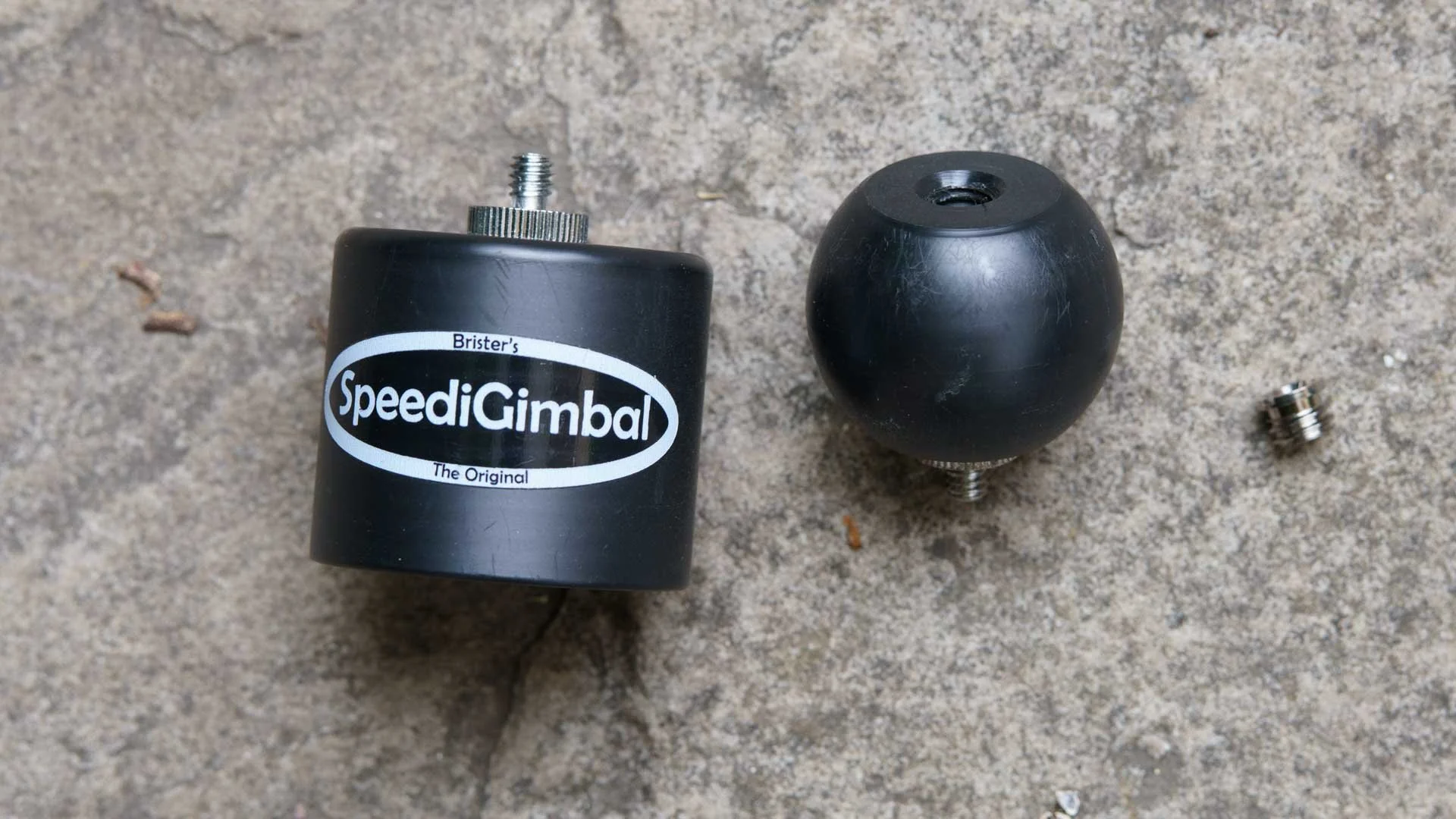  The SpeediGimbal is basically a ball that mounts on the top of a monopod and a cup that attaches to a camera or lens. The cup fits over the ball to take the weight of the camera while allowing freedom of movement. 