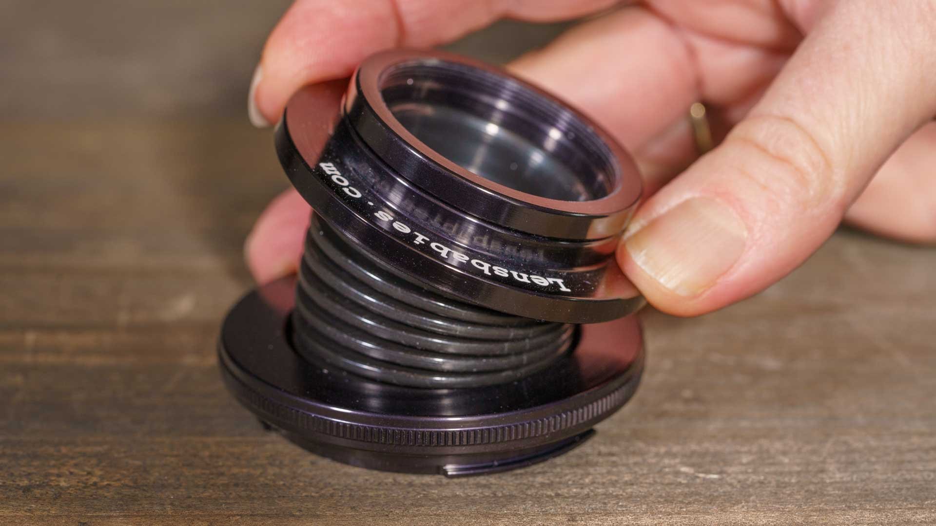 The original Lensbaby was a very simple lens with a bendy barrel and a fixed optic. There were washers (also called stops) that could be placed on the optic to set the aperture.