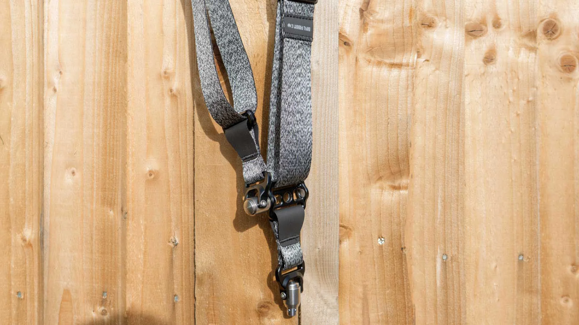 The bottom section of the 3 Legged Thing Axis 34P strap showing the QD Buckle and the Swivel connector read to attach to a camera
