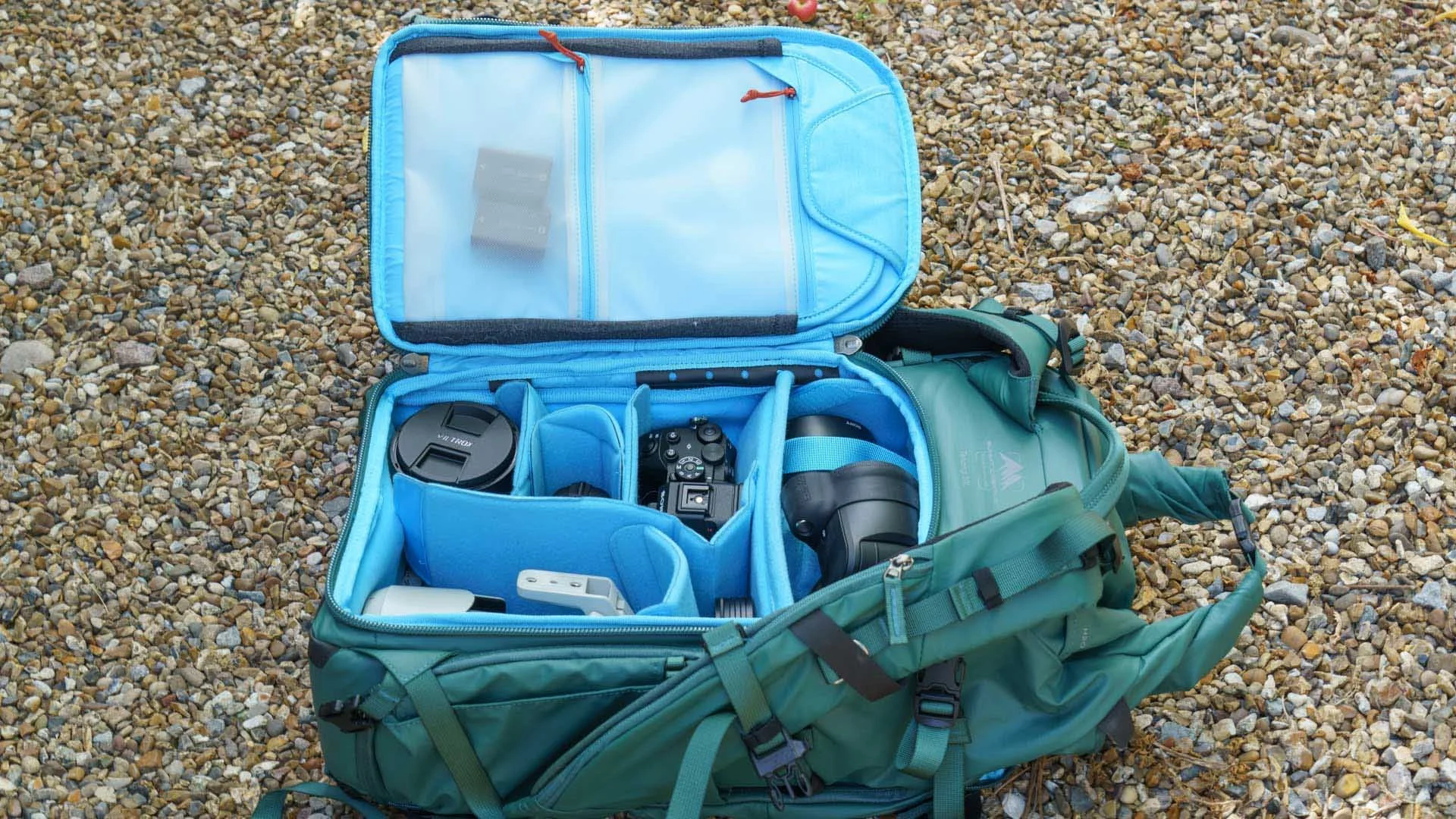  The main compartment of the Summit Creative Tenzing Roll-top 30L backpack opens from the rear and to the side. 