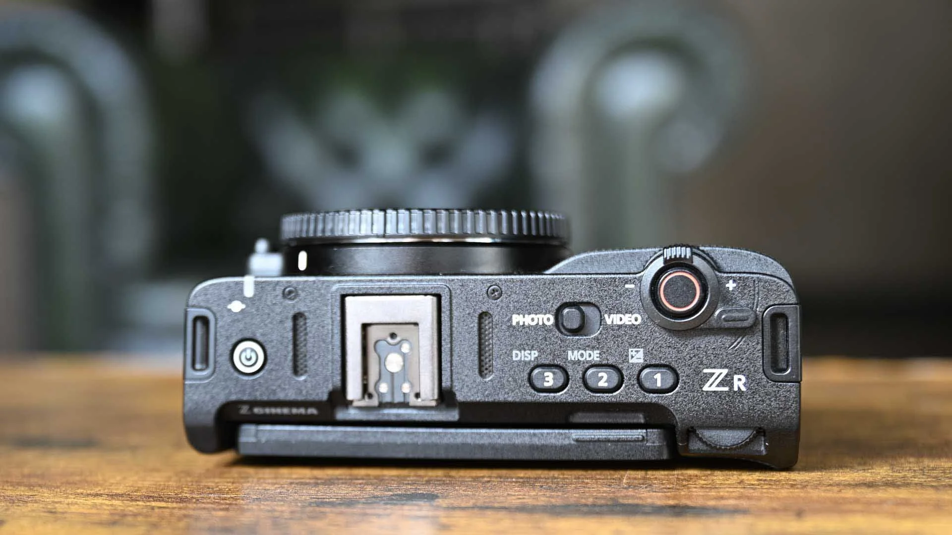 The top plate of the Nikon ZR has been redesigned compared to the Nikon Z6 III and other Z-series cameras.