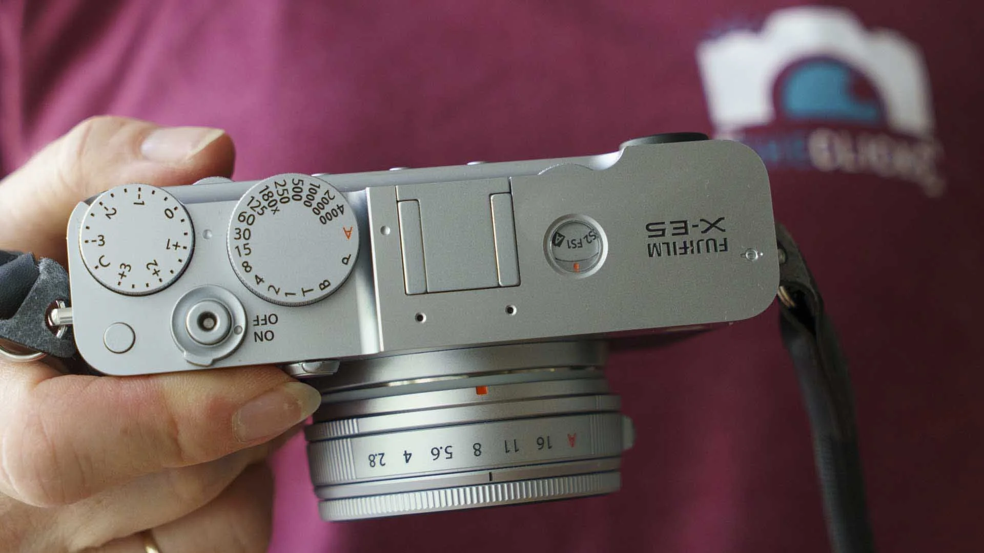  The Fujifilm X-E5 has traditional exposure controls and a new Film Simulation Mode dial on the top plate. 