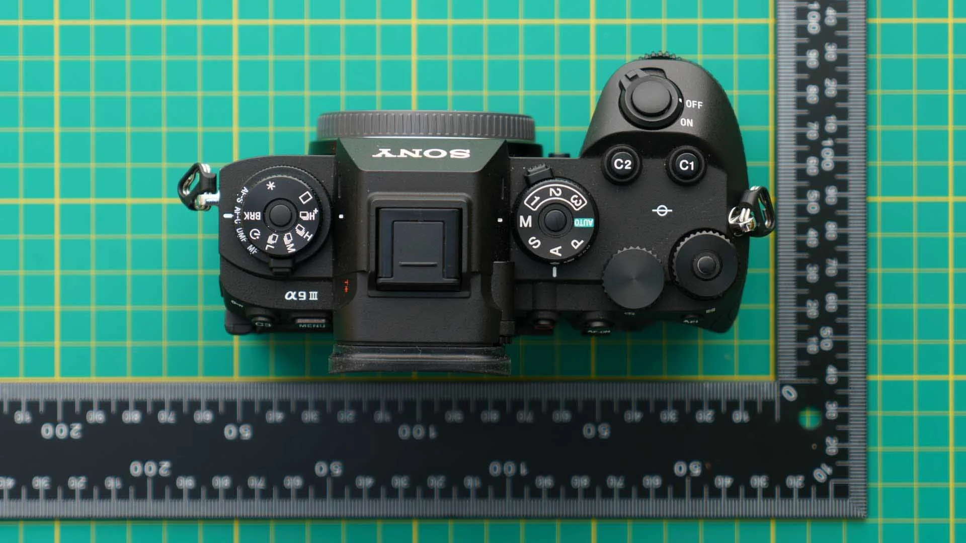 The exposure mode is set using the dial on the right of the Sony A9 III's top plate; the lock to release the photo, video and S&Q switch/dial underneath it is visible at the 11 o'clock position. Meanwhile, the stacked dials on the left of the top plate are used to set the drive and focus modes.