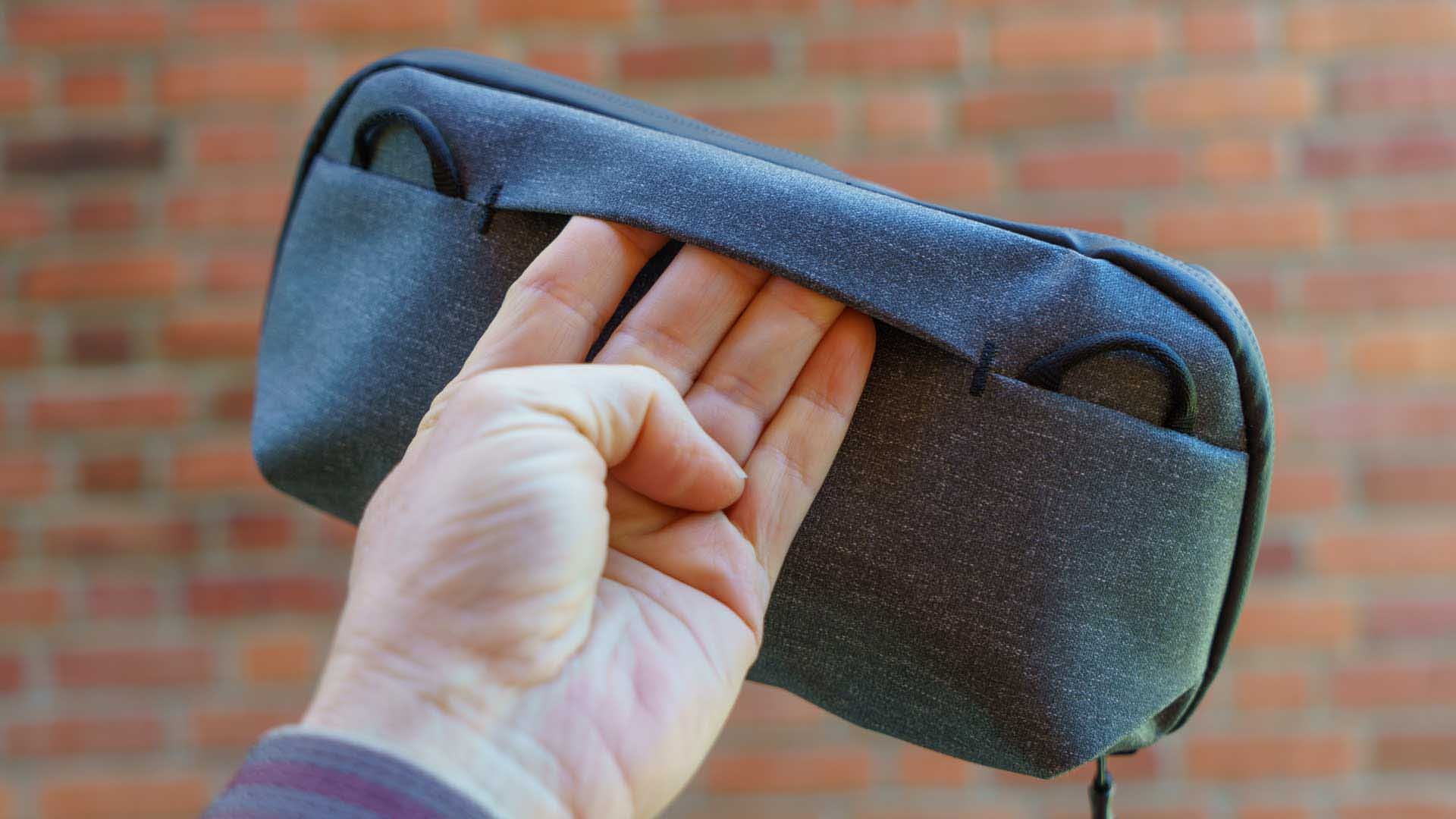  A small flap-like handle makes the Peak Design Small Tech Pouch easy to grab. Those loops can also be used to attach an optional strap. 