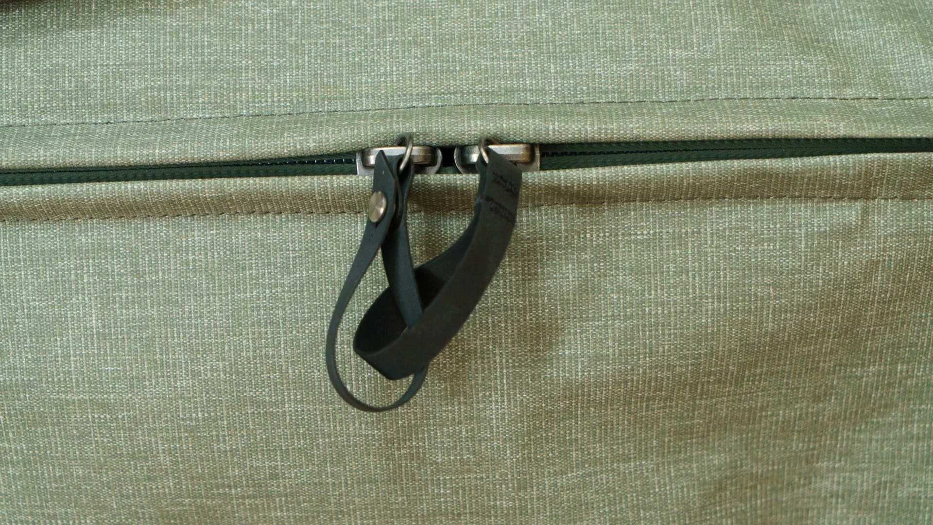  The pull loops on the main zip on the Peak Design Travel Duffel bags can be linked for a little more security. 