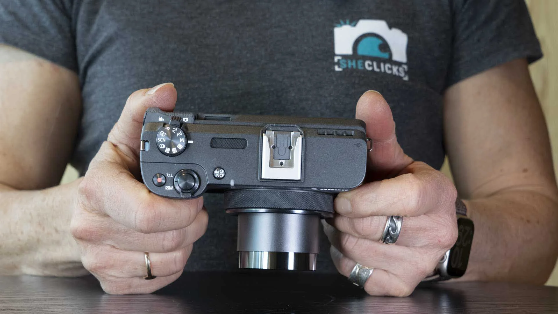 A switch on the top of the camera allows you to swap betwene stills or video shooting, leaving the mode dial free to set the exposure mode whatever you’re shooting.