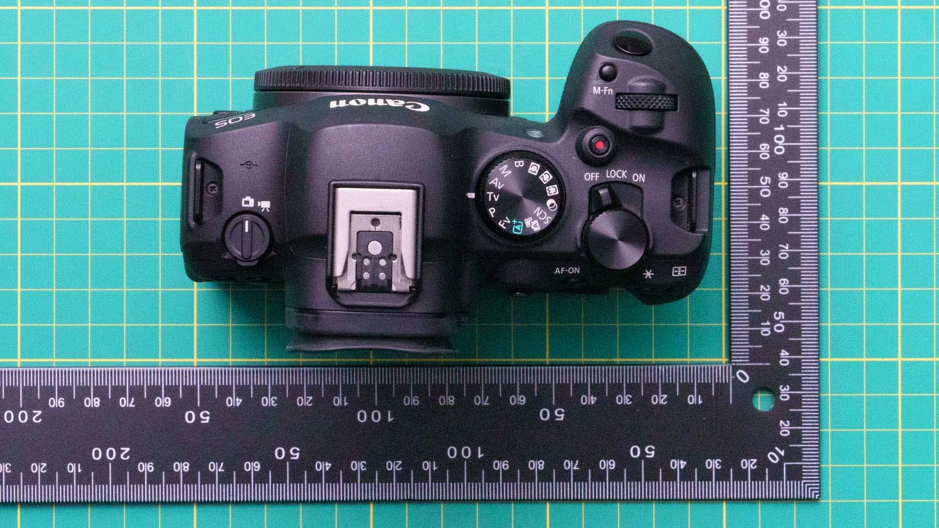  The Canon R6 Mark II has a deep grip that feels comfortable in your hand. The switch on the left of the top-plate alows you to switch quickly between stills and video recording. 