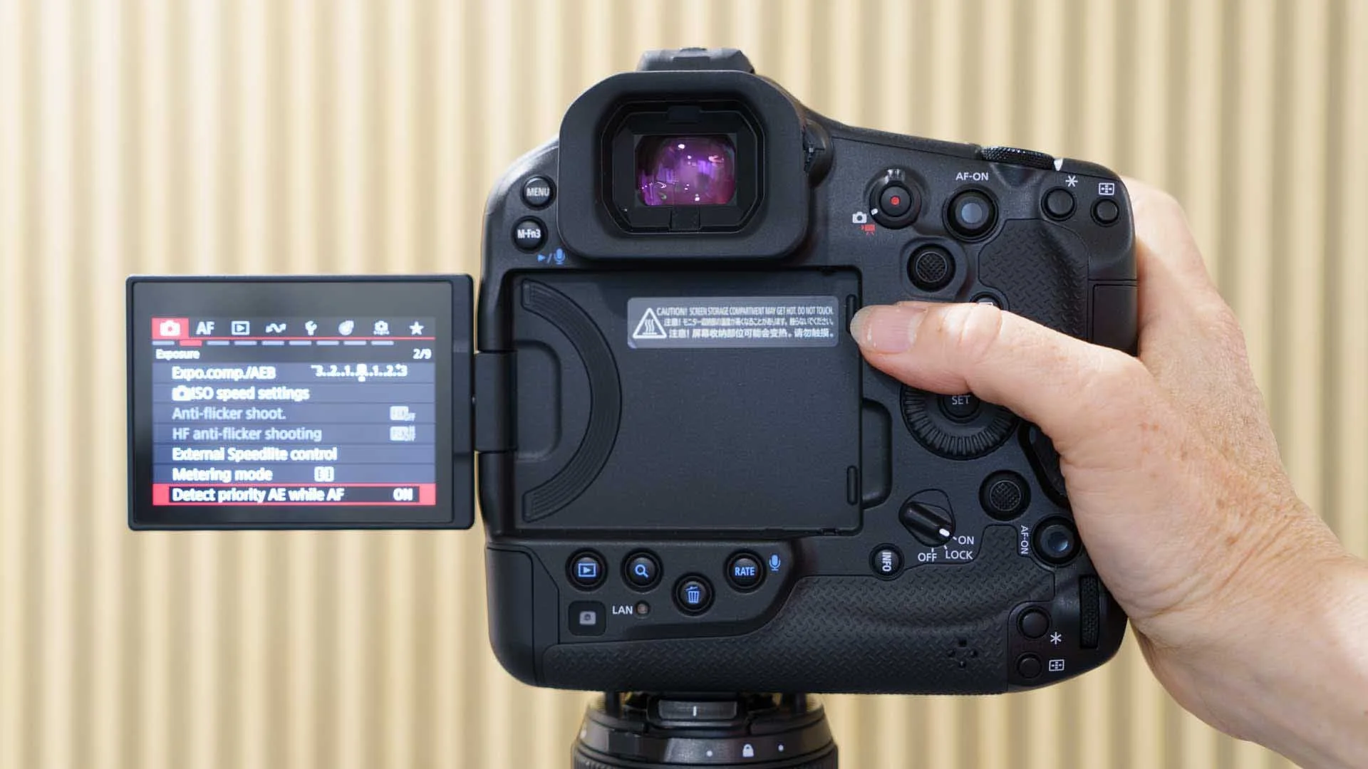  My thumb is on the Canon R1’s Info button here. 