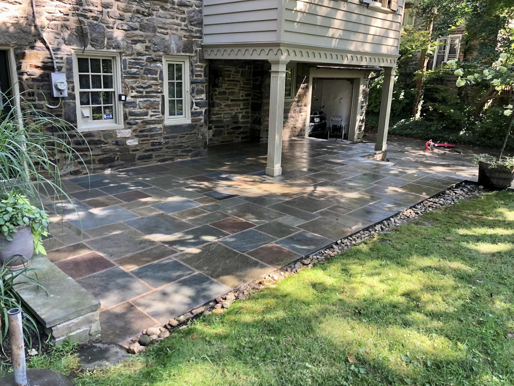 "After" flagstone patio in Bala Cynwyd. The cleaned, final product, that looks original. The joints were mixed with brown bar sand to create the aged color and a more subtle contrast between the joints and stones.