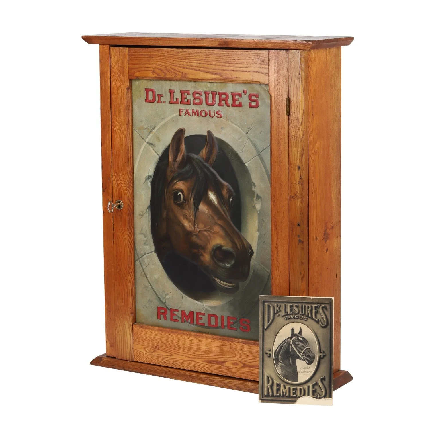 Wooden veterinary remedies store display cabinet for Dr. Lesure's Famous Remedies (Keene, N.H.), the tin lithograph panel depicting a horse in profuse detail (est. CA3,500-$5,000).