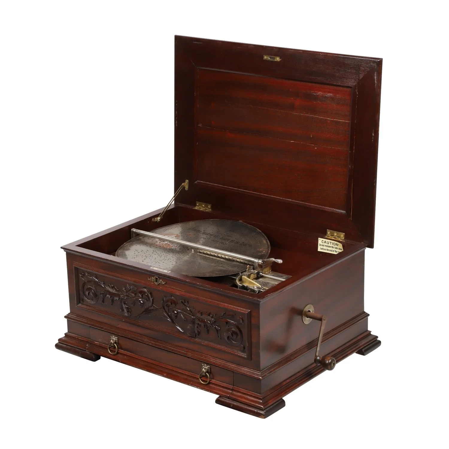 Swiss, circa 1890s Stella Grande Disc music box in a mahogany case, with paneled lid and front panel with applied carved decoration, tested and working, with 32 discs (est. CA$2,500-$3,000).