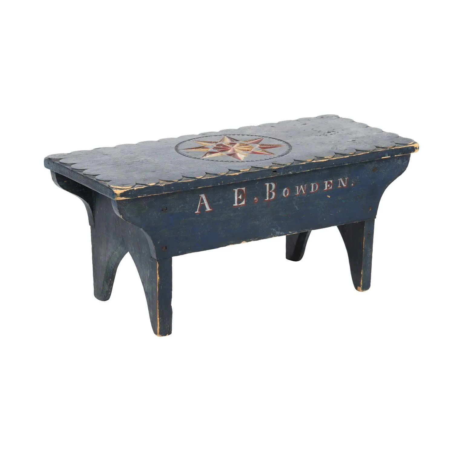 Early 19th-century footstool in original blue paint, with a deeply carved red, white and blue star at center of the top, the maker’s name ("A.E. Bowden") lettered in paint (CA$12,980).