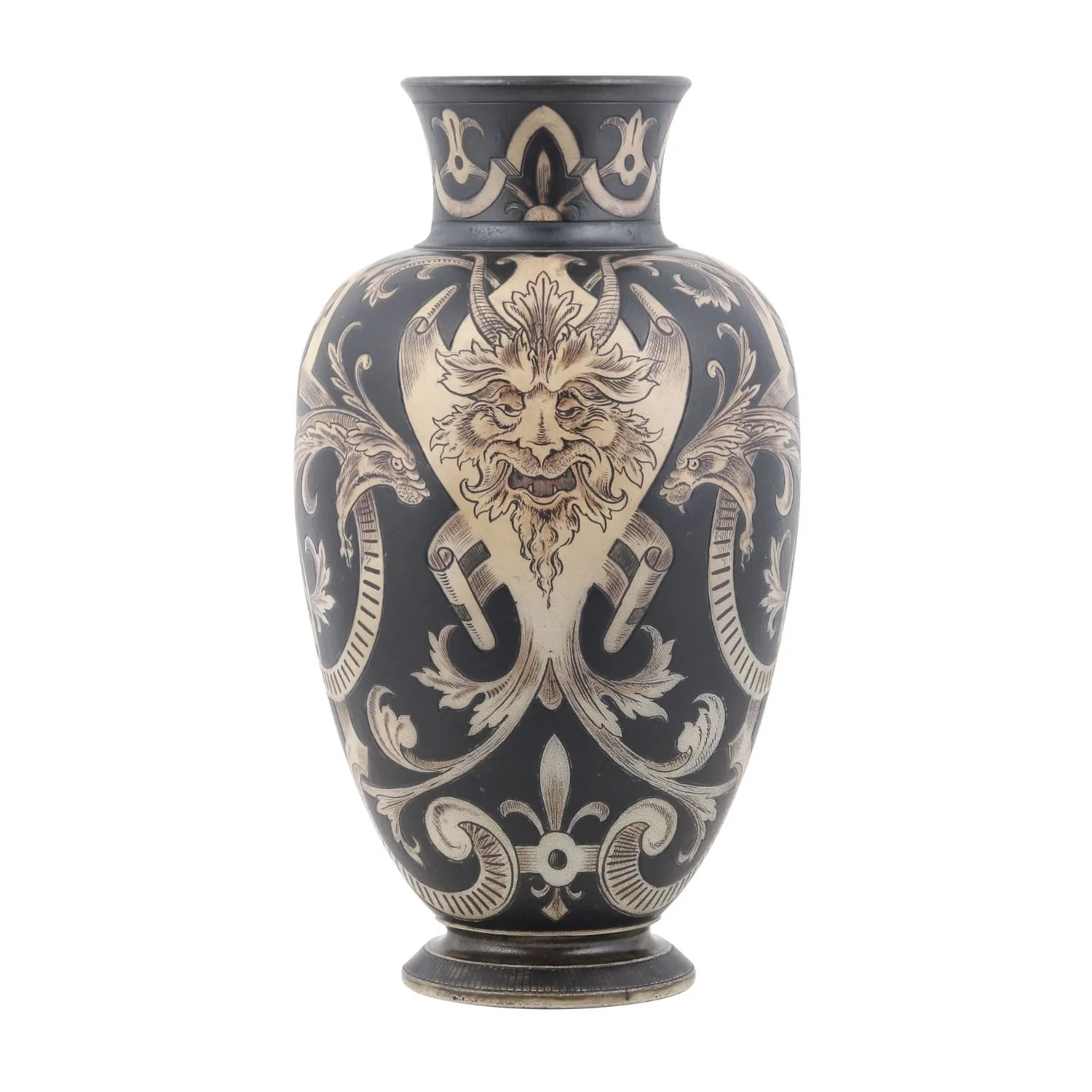 Lot 2 – Martin Brothers Gothic Vase: British, 1896. Stoneware decorated with dragons and green men, striking black-and-white patterning, 15″ x 8″ x 8″. Estimate: CA$4,000–$6,000.