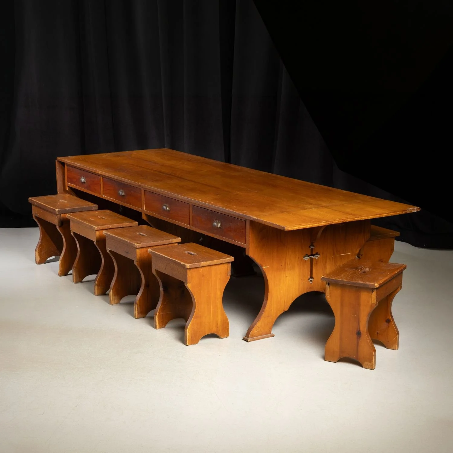 Canadian refectory table with eight matching pine stools, formerly brought to London, Ontario by the Ursuline order. Estimate: $3,000–$5,000 CAD.