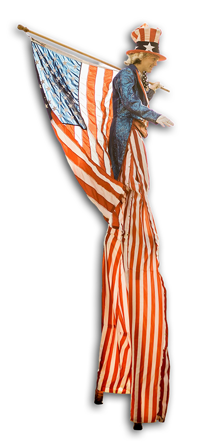 Statue of Uncle Sam with an American flag, tall on stilts, wearing a blue jacket and red-and-white striped pants, and a tall hat with red and white stripes and a blue band with white stars.
