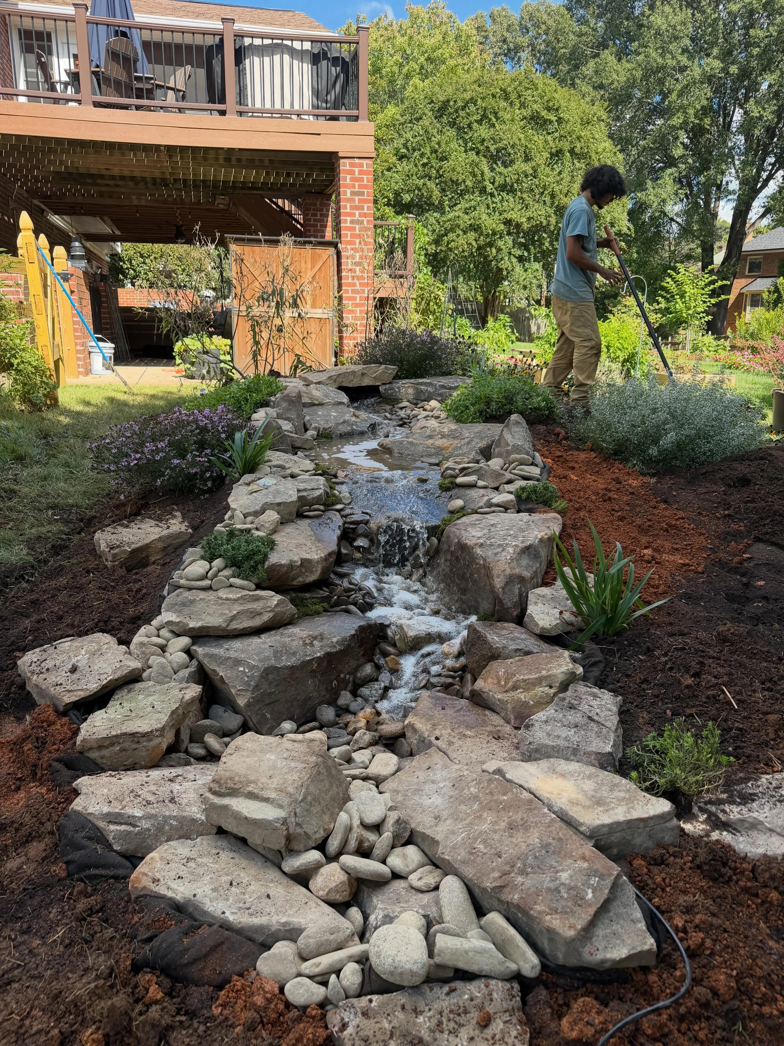 This gorgeous pondless waterfall and stream was completed in less than two days by the rockin&rsquo; and very talented Bashavia team! The natural stone and gentle bubbling cascades are sure to bring serenity and a safe oasis for wildlife for years to