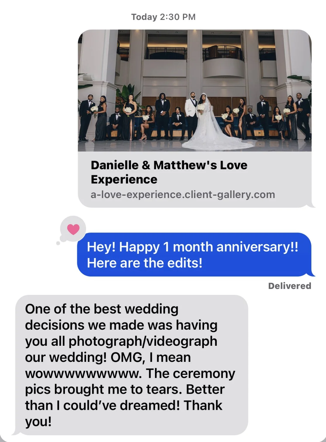 Group photo of a wedding party with the bride and groom in the center, surrounded by bridesmaids and groomsmen, in an elegant indoor venue.